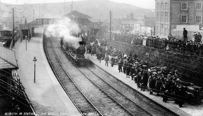 Leaving Redruth railway station for mining work in South Africa - the wives watch on