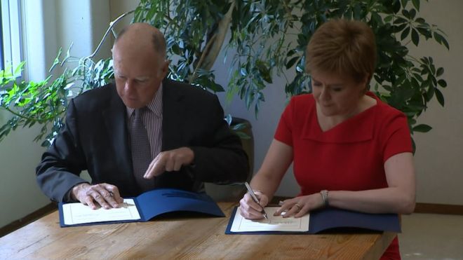 Jerry Brown and Nicola Sturgeon sign climate agreement picture from BBC